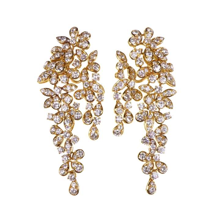 Pair of diamond foliate cluster long pendant earrings by Boucheron, stylised wisteria